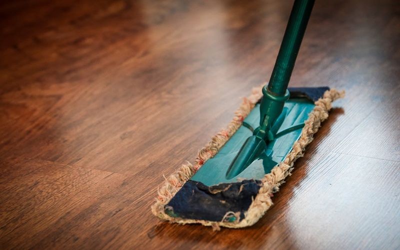 Wipe down the tiles with a damp mop or cloth